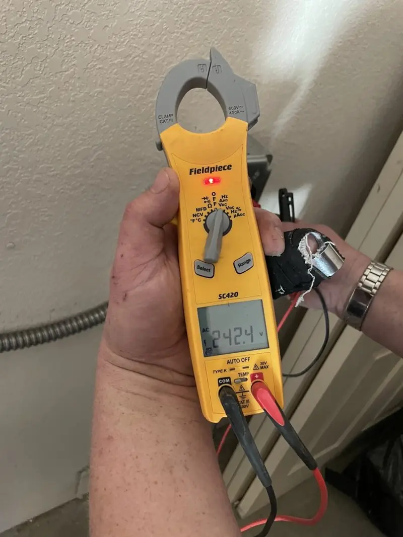 Voltage testing with clamp meter during Outlet Installation in Summit